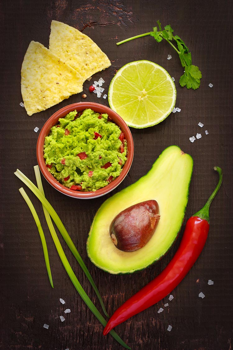 Mexican Food avocado, guacamole, chips, peppers